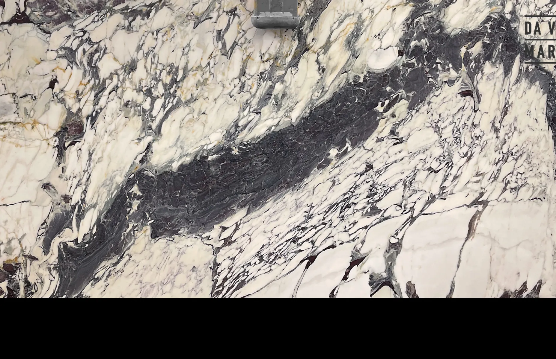 Closeup image of Breccia Capraia White Marble countertop slab