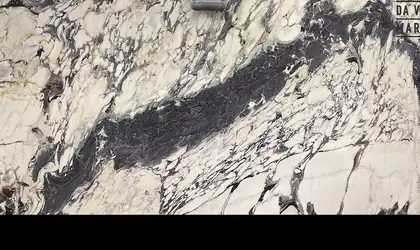 Closeup image of Breccia Capraia White Marble countertop slab