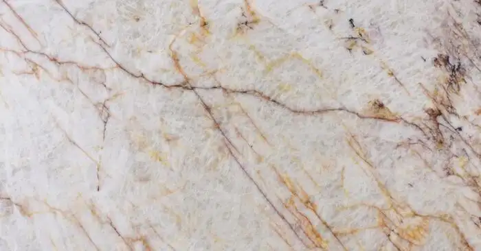 Closeup image of Cristallo Fire Cream Quartzite countertop slab