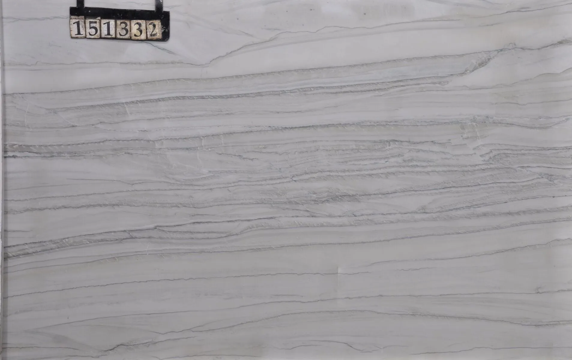 Closeup image of Ivory Macaubas 1st Choice Grey Quartzite countertop slab