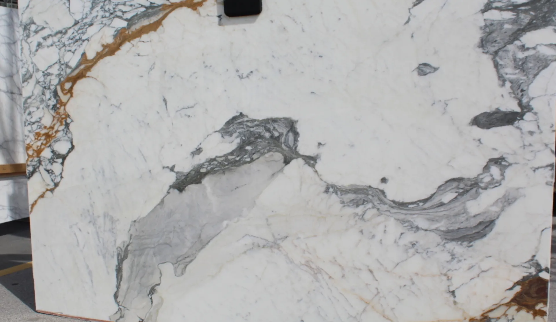 Closeup image of Paonazzo Corchia White Marble countertop slab