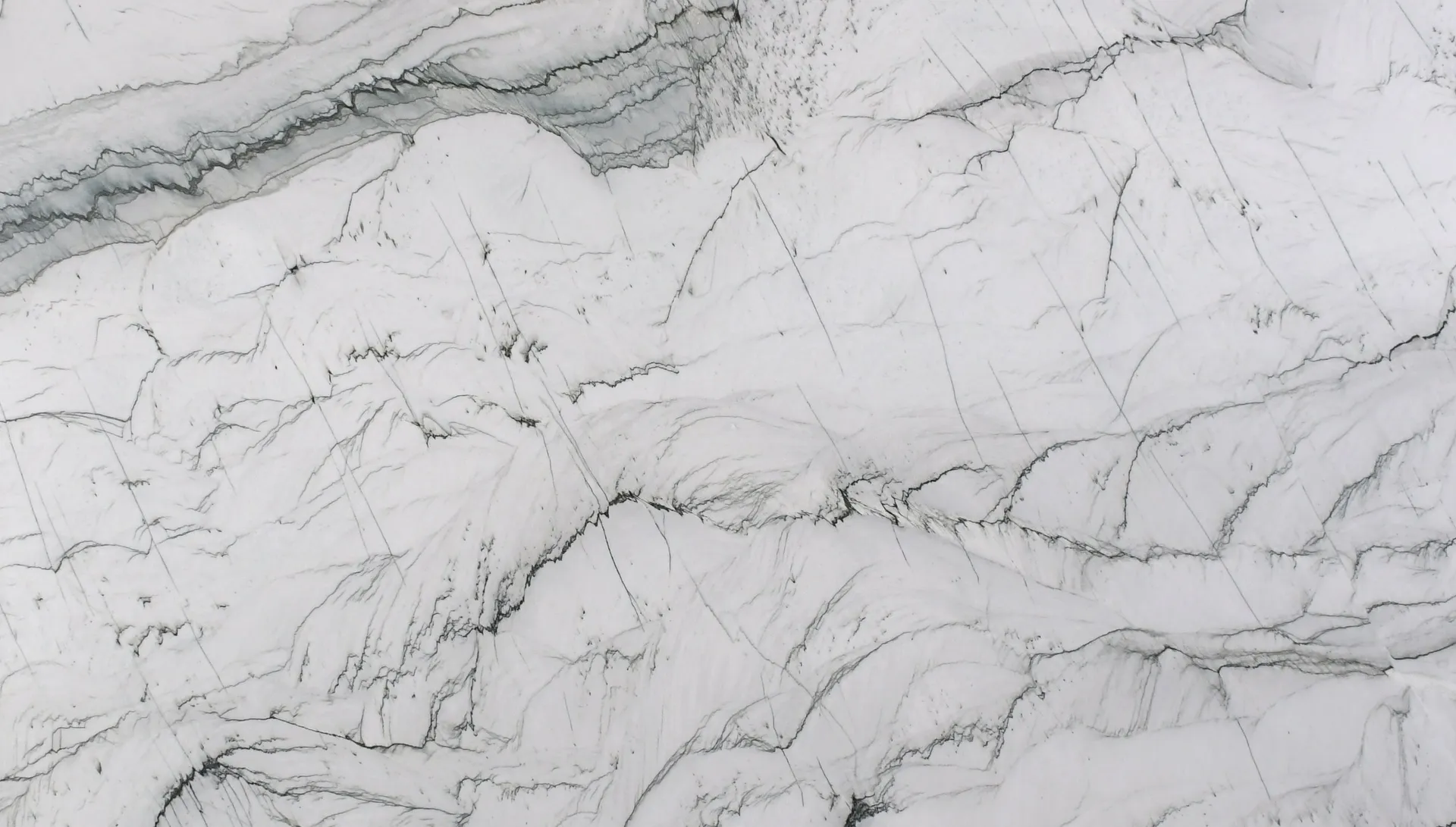 Closeup image of Statuario Quartzite White Quartzite countertop slab