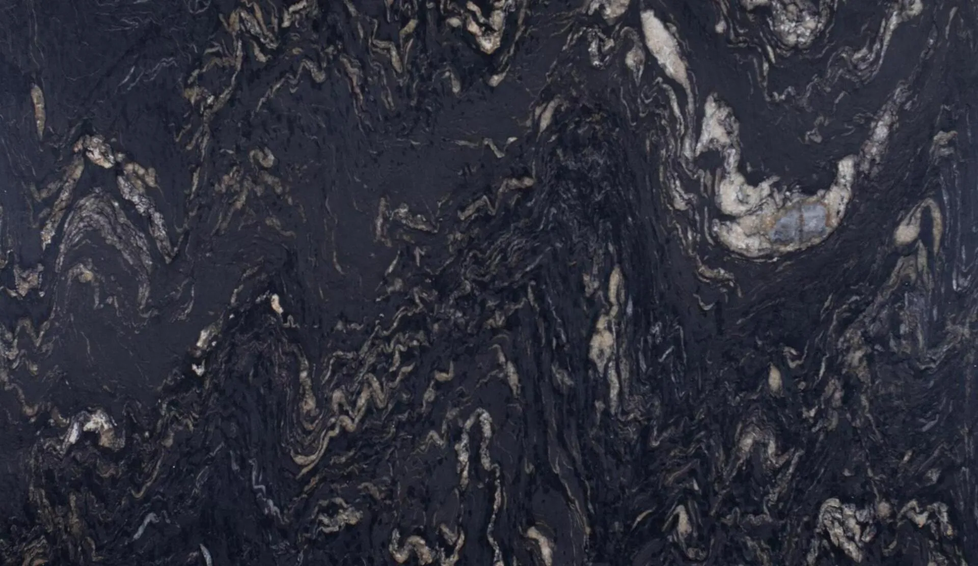 Closeup image of Titanium Gold Black Granite countertop slab