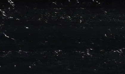 Closeup image of Via Lactea Polished (Leather) Black Granite countertop slab