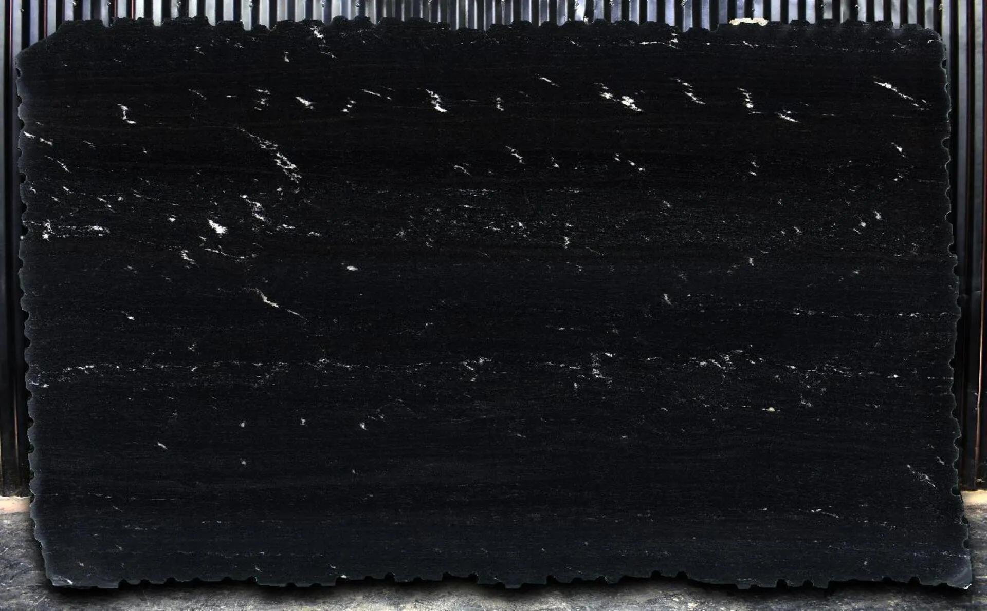 Image of Via Lactea Polished (Leather) Black Granite countertop slab