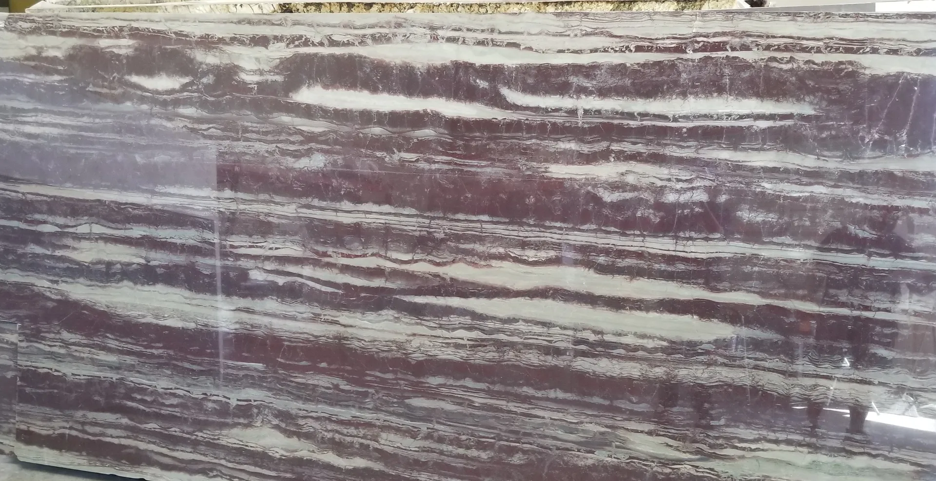 Closeup image of Violet Bamboo Red-Pink Quartzite countertop slab