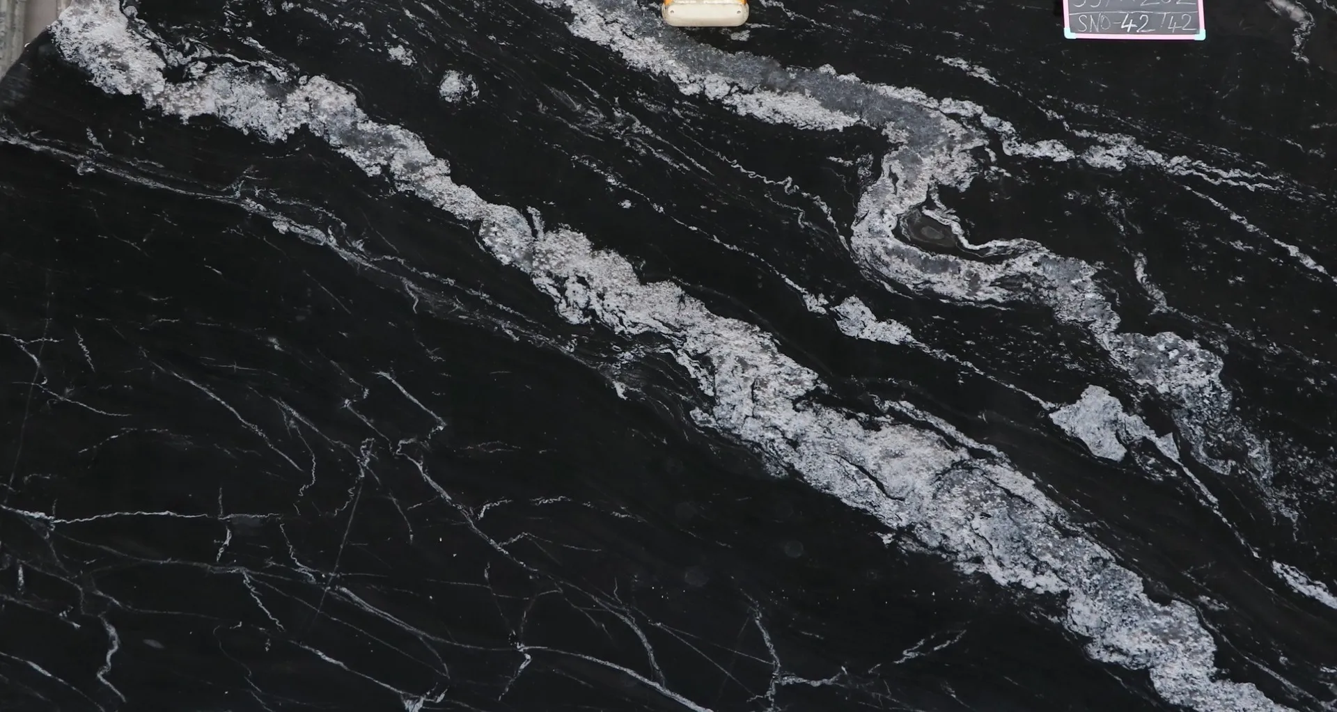 Closeup image of Black Forest Black Granite countertop slab