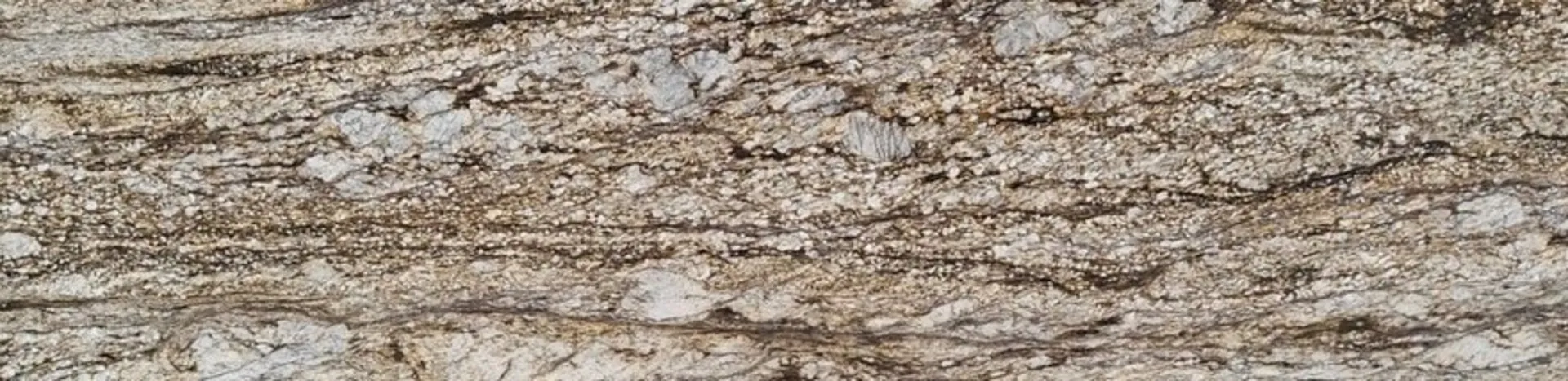Closeup image of Blue Dunes (Thunder Mountain) Brown Granite countertop slab